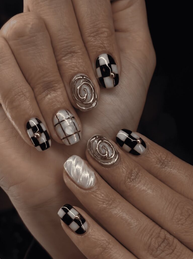 Black and white checkered nail art with gold accents at Ivory Nail Boutique, Victoria BC