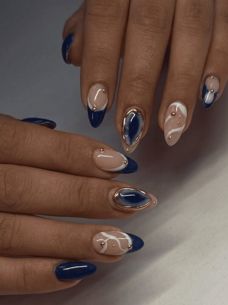 Navy blue and gold leaf luxury nail design at Ivory Nail Boutique, Victoria BC