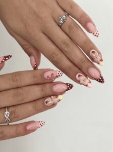 Neutral almond nails with delicate 3D flower nail art at Ivory Nail Boutique, Victoria