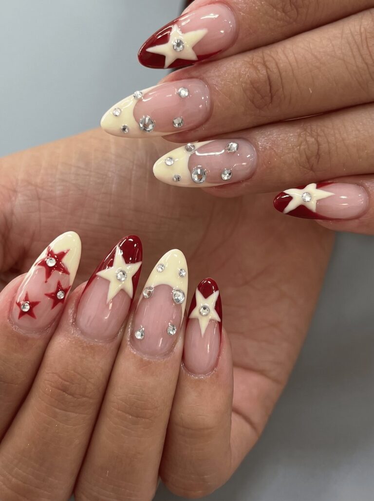 Red and cream French nails with star nail art at Ivory Nail Boutique, Victoria